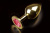 Пикантные Штучки - Большая золотистая анальная пробка с закругленным кончиком, 9х4 см (рубиновый) - sex-shop.ua