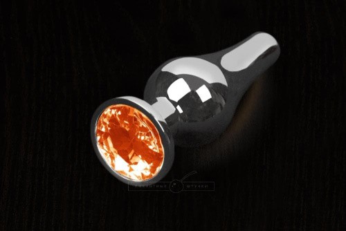 Пикантные Штучки - Серебристая анальная пробка с кристаллом, 8,5х3 см (оранжевый) - sex-shop.ua